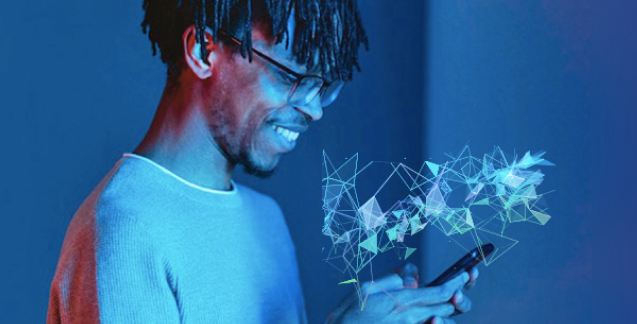 black man looking at a phone while smiling